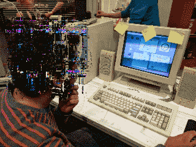 A playtester sitting in front of a computer, playing our shortened experience at an exposition.